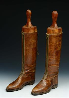 Lot 148 - A PAIR OF EDWARDIAN LADIES BROWN LEATHER RIDING BOOTS with zip fasteners and wooden trees