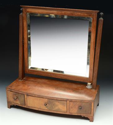 Lot 158 - A VICTORIAN MAHOGANY SWING TOILET MIRROR with bow fronted box base labelled J. Taylor Colchester