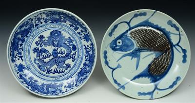 Lot 204 - A CHINESE BLUE AND WHITE PORCELAIN BOWL decorated with a dragon chasing a flaming pearl