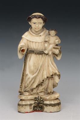 Lot 215 - AN ANTIQUE CONTINENTAL IVORY FIGURE of a monk holding the infant Jesus on a stepped base