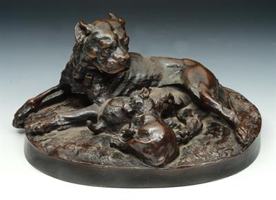 Lot 216 - A FILLED BRONZE GROUP of a bull terrier suckling her puppies on a naturalistic oval base