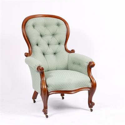 Lot 223 - A VICTORIAN MAHOGANY FRAMED GENTLEMAN'S ARMCHAIR with serpentine front and cabriole legs upholstered