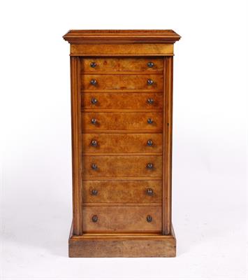 Lot 224 - A VICTORIAN FIGURED WALNUT WELLINGTON CHEST of eight long graduated drawers with turned knobs and lo