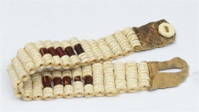 Lot 238 - A SOUTH AFRICAN SAN 'BUSHMAN' BRACELET of ostrich shell beads with leather clasp