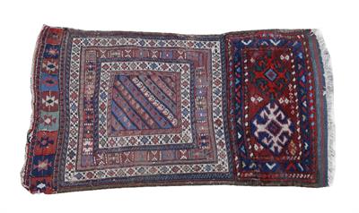 Lot 372 - AN OLD MIDDLE EASTERN SADDLE BAG with a diagonal design and multiple border