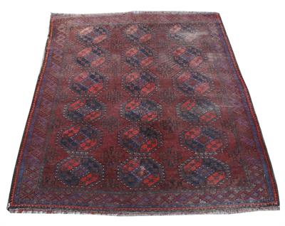 Lot 374 - AN OLD AFGHAN RED GROUND SMALL CARPET decorated three rows of octagons within a geometric border