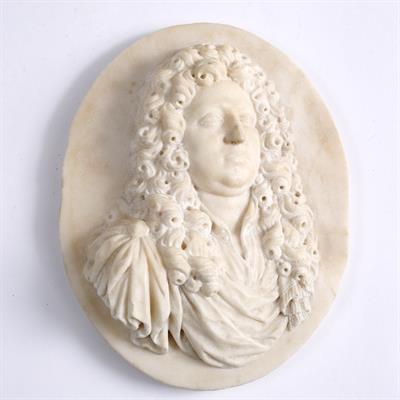 Lot 397 - AN 18TH CENTURY OVAL MARBLE PLAQUE depicting a portrait in relief probably of Handel