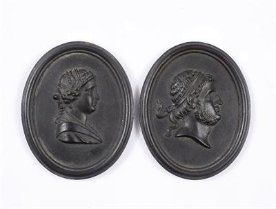 Lot 408 - A PAIR OF 18TH CENTURY BLACK BASALT OVAL MINIATURE PLAQUES described on the back Iphigenia; and Prus