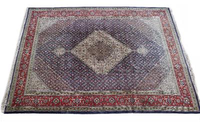 Lot 442 - A PERSIAN BLUE AND RED GROUND FORMAL CARPET with central medallion within a scrolling border