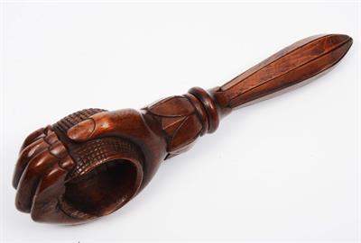 Lot 77 - A TREEN CARVED WOODEN NUTCRACKER