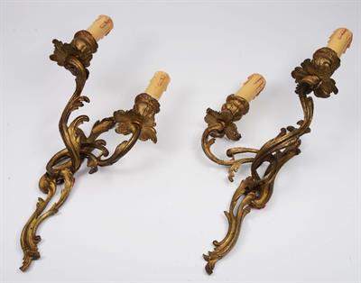 Lot 84 - A PAIR OF ROCOCO GILT METAL TWO BRANCH WALL LIGHTS