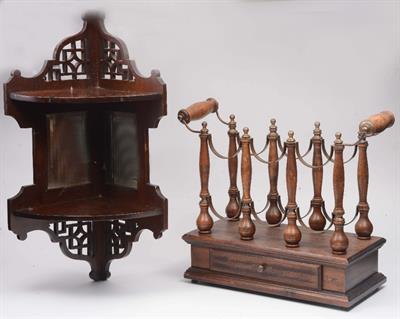 Lot 87 - A CONTINENTAL WOODEN BRASS SIX BOTTLE WINE RACK