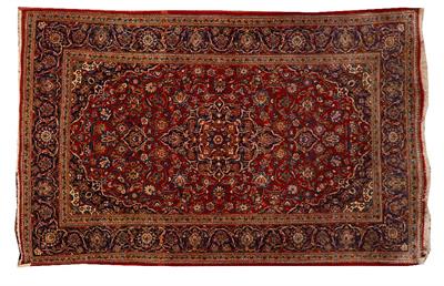 Lot 130 - A PERSIAN KASHAN RED GROUND RUG