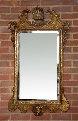 Lot 155 - A GEORGE II STYLE GILTWOOD HANGING WALL MIRROR