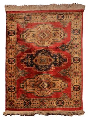 Lot 180 - A PERSIAN PATTERN BRICK RED GROUND RUG