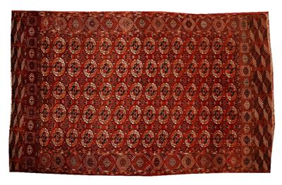 Lot 242 - AN OLD TEKKE BOKHARA BRICK RED GROUND CARPET