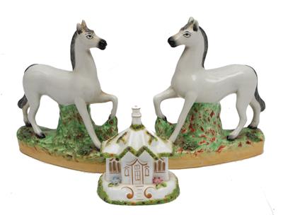 Lot 258 - A PAIR OF STAFFORDSHIRE POTTERY MODELS OF WHITE HORSES