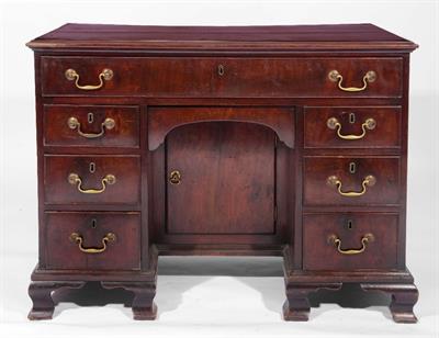 Lot 297 - A GEORGE III MAHOGANY KNEEHOLE DESK