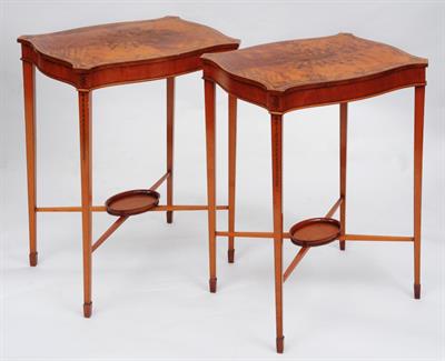 Lot 316 - A PAIR OF EDWARDIAN SATINWOOD SERPENTINE SIDE TABLES