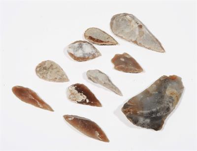 Lot 374 - A GROUP OF NINE BRITISH NEOLITHIC FLINT ARROW HEADS