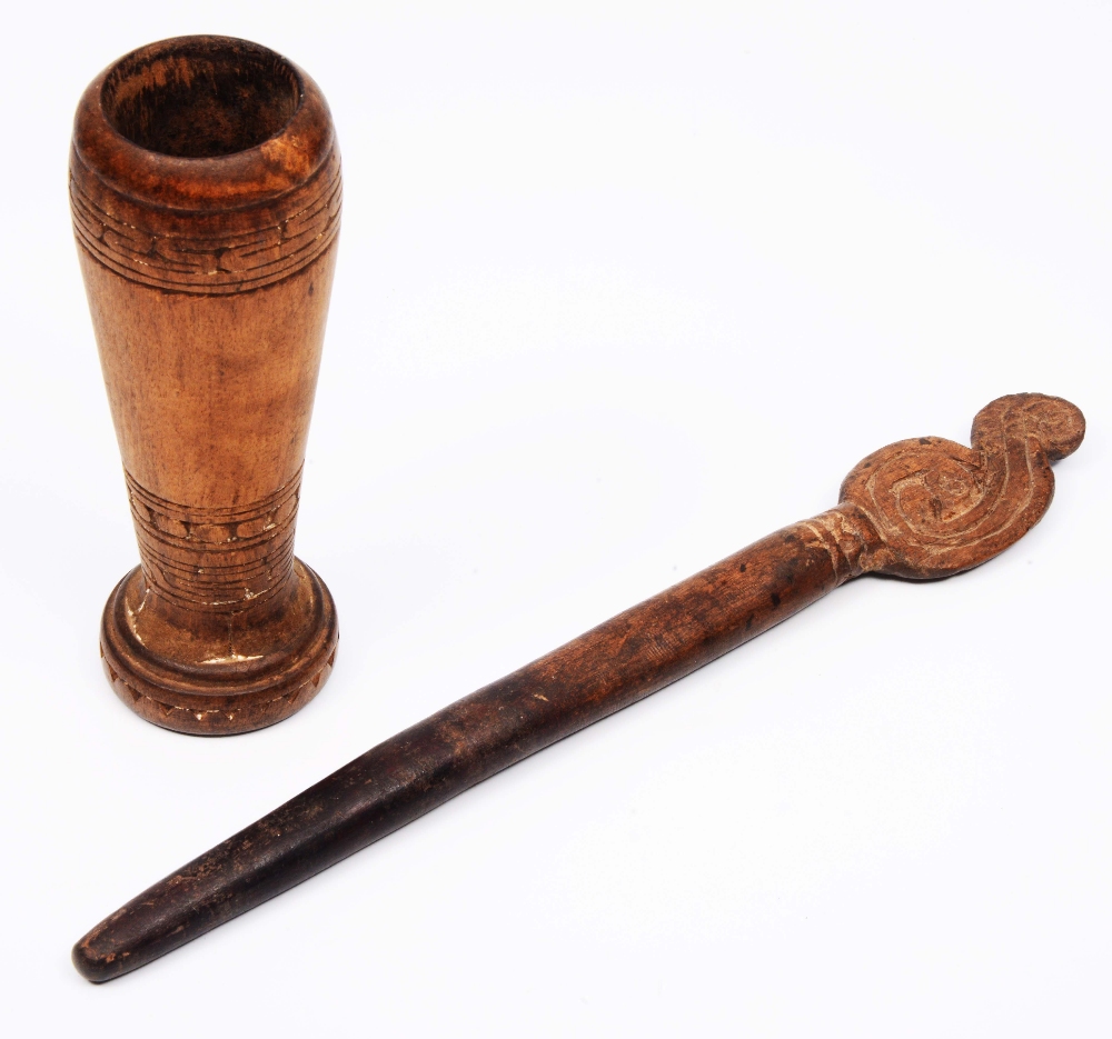 Lot 384 - A NEW GUINEA TROBRIAND ISLANDS MASSIM LIME WOOD PESTLE AND MORTAR