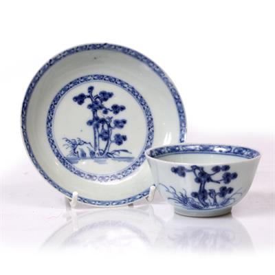 Lot 180 - A NANKING CARGO BLUE AND WHITE TEA BOWL AND SAUCER