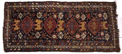 Lot 187 - A NORTHERN PERSIAN MIDNIGHT BLUE GROUND LONG RUG