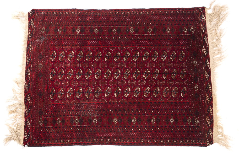 Lot 192 - A TEKKE DARK RED GROUND RUG