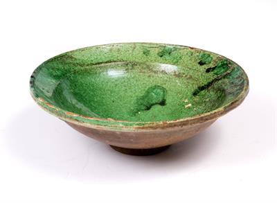 Lot 221 - A MIDDLE EASTERN GREEN GLAZED TERRACOTTA CIRCULAR BOWL