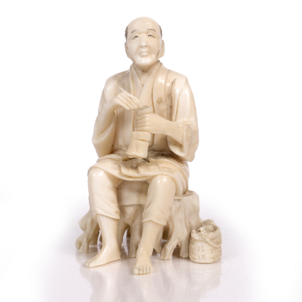 Lot 292 - A JAPANESE MEIJI PERIOD CARVED IVORY OKIMONO