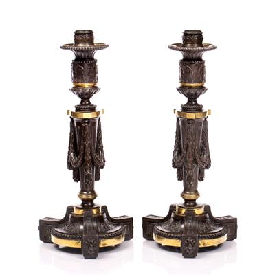 Lot 313 - A PAIR OF LOUIS XV1 STYLE BRONZE AND PARCEL GILT CANDLESTICKS