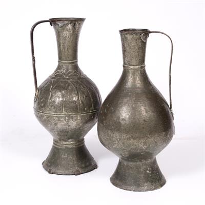 Lot 341 - TWO 19TH CENTURY CAUCASIAN LARGE BEATEN METAL BALUSTER JUGS