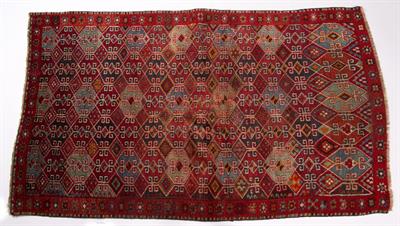 Lot 365 - A KURDISH RED GROUND RUG