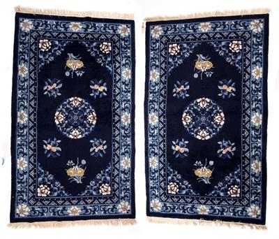 Lot 370 - A NEAR PAIR OF CHINESE DARK BLUE GROUND RUGS