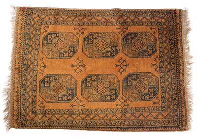 Lot 373 - AN AFGHAN DARK OCHRE GROUND RUG