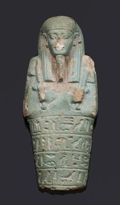 Lot 411 - AN ANCIENT EGYPTIAN FAIENCE FUNERARY SHABTI