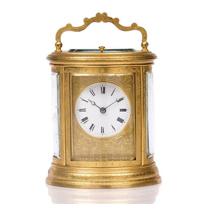 Lot 12 - A 19TH CENTURY FRENCH OVAL GILT BRASS CARRIAGE CLOCK