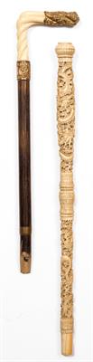 Lot 127 - A 19TH CENTURY CHINESE CARVED IVORY CANE HANDLE