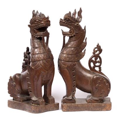 Lot 193 - A PAIR OF LATE 19TH CENTURY ORIENTAL CARVED WOODEN QILIN