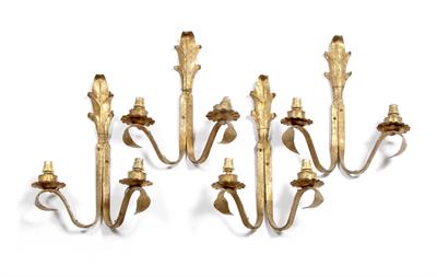 Lot 40 - A SET OF FOUR OLD GILT METAL TWO BRANCH WALL LIGHTS with acanthus leaf crest