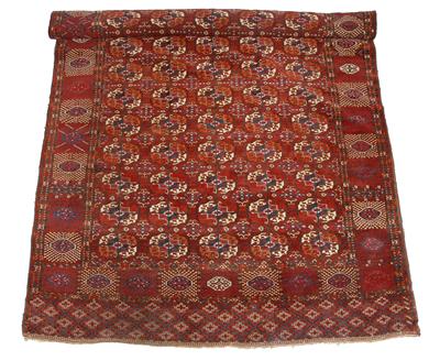 Lot 63 - A BELOUCH  RED GROUND LARGE RUG with central geometric decoration and typical banded border