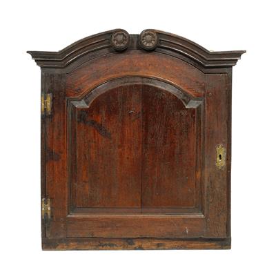 Lot 114 - A GEORGE II OAK SPICE CUPBOARD with scrolling arching pediment over a conforming panelled door enclo