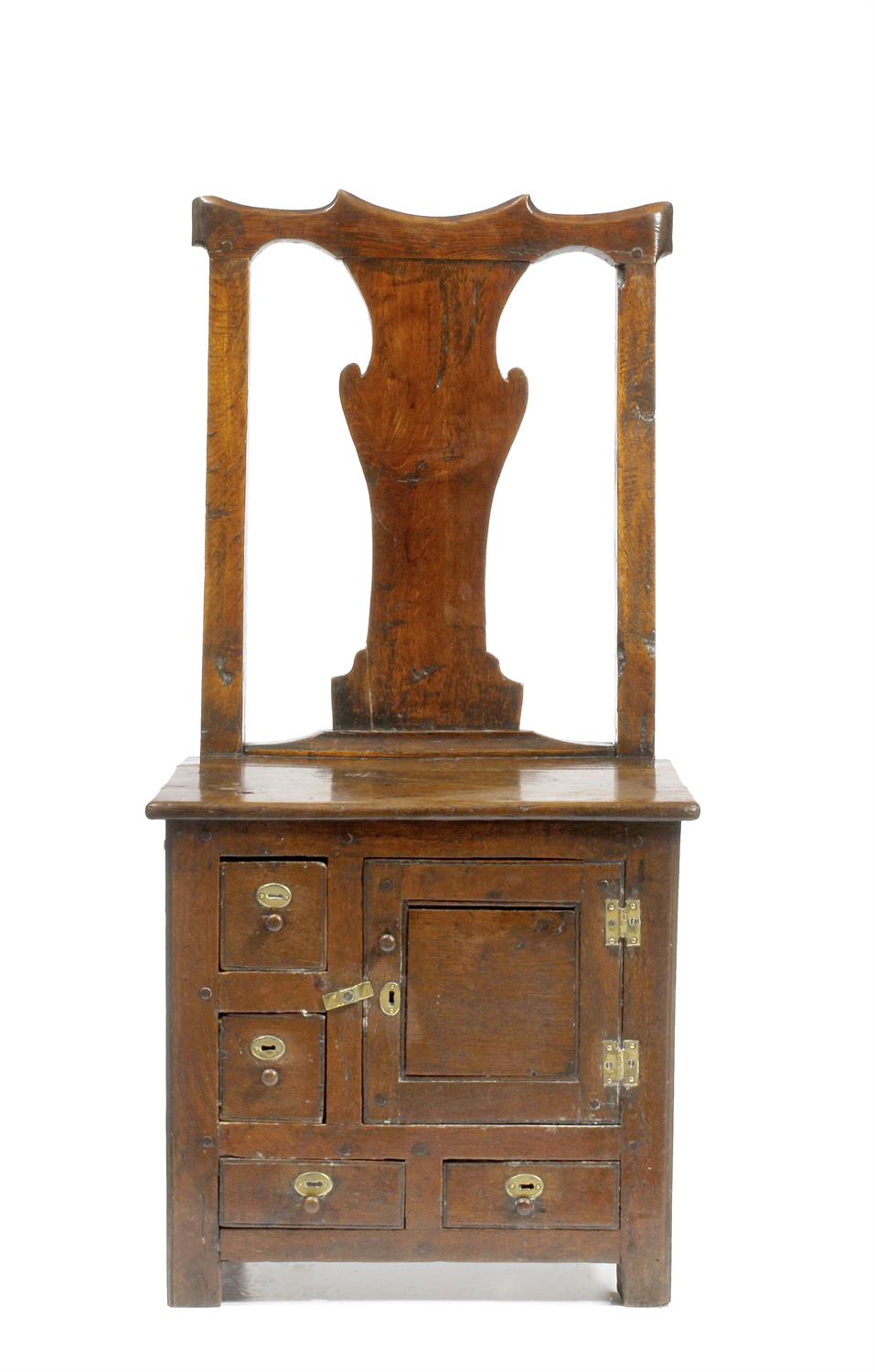 Lot 202 - A GEORGE III IRISH OAK COUNTRY CHAIR possibly from County Antrim with solid vase shaped splat back a