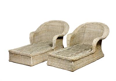 Lot 214 - A PAIR OF LARGE EARLY 20TH CENTURY WICKER LOUNGER CHAIRS with arching backs and integral footrests t