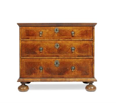 Lot 220 - A MID 18TH CENTURY WALNUT CROSSBANDED AND FEATHER BANDED CHEST OF THREE LONG DRAWERS with brass drop