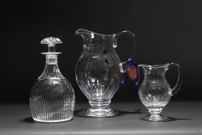 Lot 257 - A CONTEMPORARY WILLIAM YEOWARD CUT GLASS JUG with looping handle and circular spreading base 25.5cm