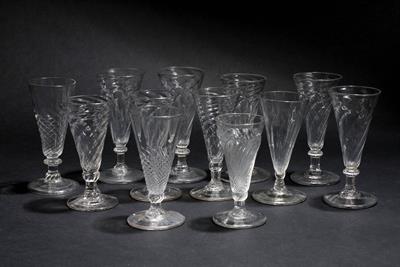 Lot 345 - A GROUP OF TWELVE DWARF ALE GLASSES with wrythen decoration to the conical bowls