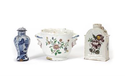 Lot 351 - A GERMAN FAIENCE TIN GLAZED POTTERY DECORATED TEA CANISTER with panelled sides 12.5cm high together