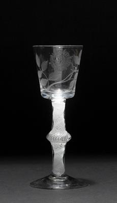 Lot 378 - AN 18TH CENTURY CORDIAL GLASS the bucket shaped bowl engraved with a rose on a stem with central kno