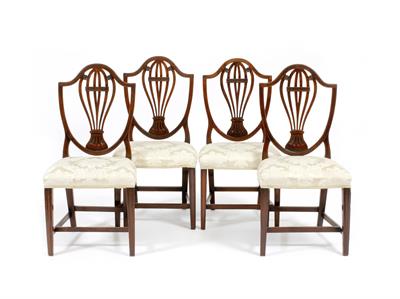 Lot 434 - A SET OF FOUR GEORGIAN MAHOGANY HEPPLEWHITE STYLE SHIELD BACK DINING CHAIRS with pierced scrolling s